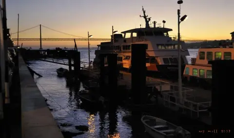 Ferries at Cacilhas with the 25 de Abril bridge beyond
